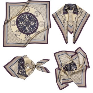 May include: Four silk scarves in different arrangements. Each scarf features a cream-colored background with a repeating pattern and a central design in navy and purple. The scarves have a border in shades of gray and purple.