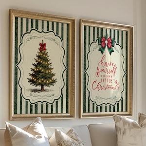 May include: Two framed rectangular wall art prints featuring a dark green and white vertical striped background. One print displays a decorated Christmas tree with a red bow, while the other features the text Have yourself a merry little Christmas.