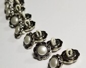 Pearl Look Buttons. Plastic Shank Back Buttons. Silver Look with Pearl Look Center.