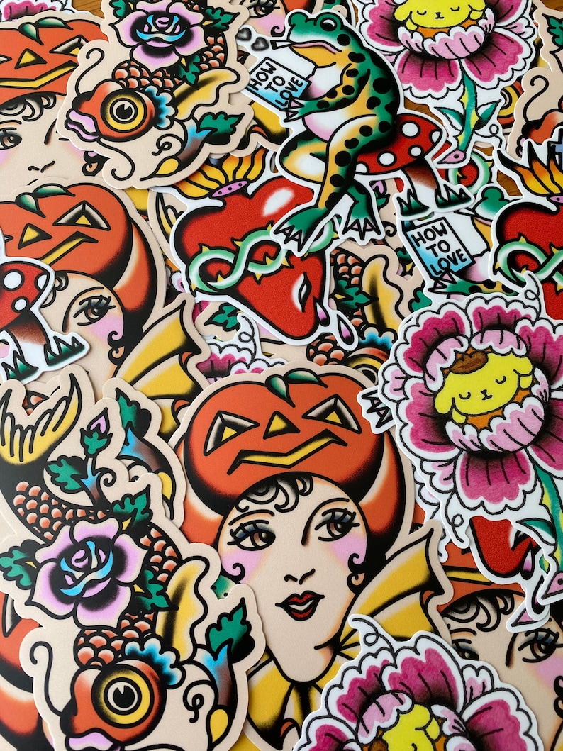 May include: A collection of colorful stickers with a vintage tattoo art style. Designs include a frog on a mushroom, a heart with vines, a pumpkin-headed woman, and various flowers. Some stickers have the text "HOW TO LOVE".
