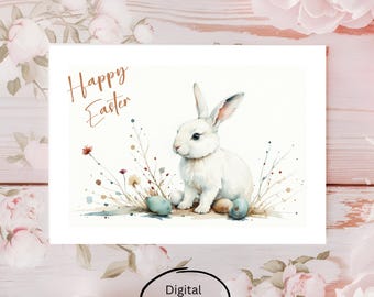 Könnte beinhalten: Ein digitaler Download einer Aquarell-Illustration eines weißen Kaninchens, das auf einem Nest aus blauen und braunen Ostereiern mit einem floralen Hintergrund sitzt. Der Text "Happy Easter" ist oben im Bild in brauner Schrift geschrieben.