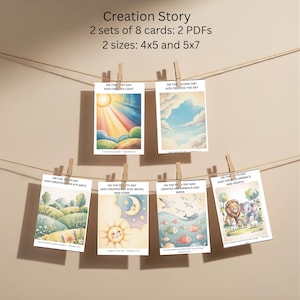 May include: A set of eight illustrated cards depicting the Creation Story, clipped to a string with wooden clothespins. The cards feature colorful illustrations of the sun, sky, land, sea creatures, and animals. Text on the cards includes "Creation Story" and "Genesis".