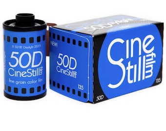 May include: A blue and white box of 50D CineStill film, a fine grain color film for 35mm cameras. The box has the text "CineStill" and "50D" on it. The film canister is also blue and white and has the text "50D CineStill" and "fine grain color film" on it.