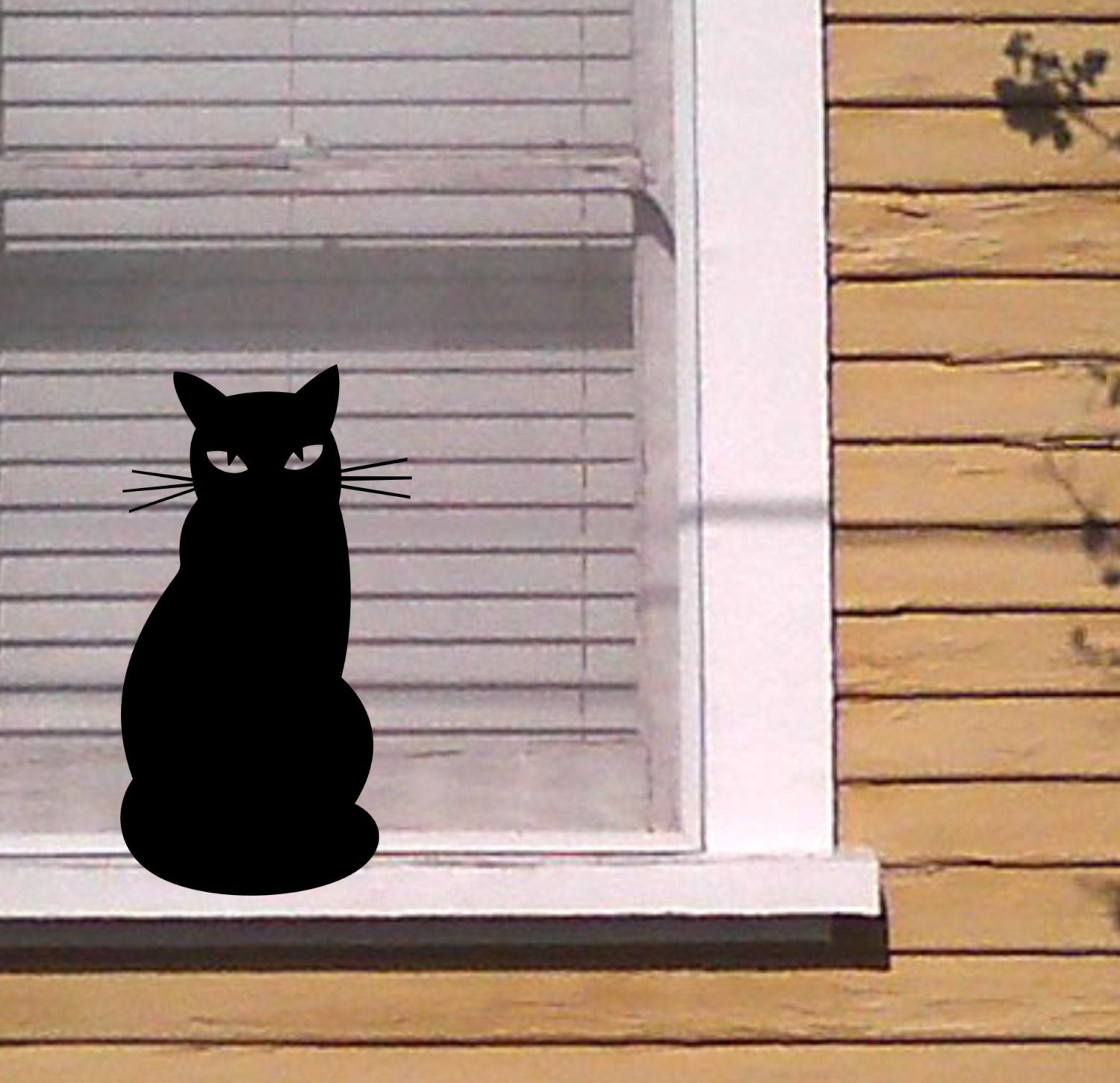 Sticker PC Silhouette de chat sur fond noir - TenStickers