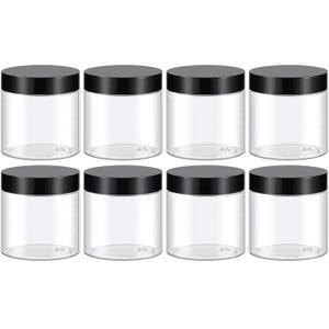 May include: Eight clear, cylindrical plastic jars with black screw-on lids. The jars are empty and evenly spaced, offering a clean, minimalist aesthetic. Ideal for storing various items, these jars are a practical storage solution.