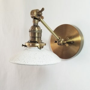 Style#103 Adjustable wall sconce available in a variety of sizes