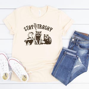 Stay Trashy Unisex Tshirt | Retro Funny Graphic Tees | Racoon Meme Graphic T-Shirt | Raccoon Lover Gift | Funny Meme Graphic