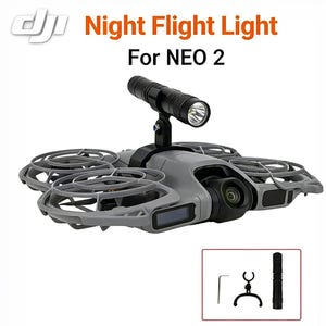 May include: A grey drone with a black flashlight attached. The text "Night Flight Light For NEO 2" is displayed in orange. Additional accessories are shown in a small inset.