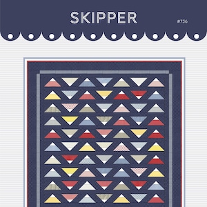 May include: A quilt pattern called "Skipper" #736 by Gigi's Thimble. The pattern features a navy blue background with a repeating pattern of colorful triangles.