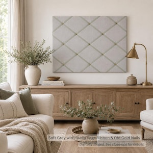 May include: A rectangular light grey fabric memo board featuring a diamond-patterned ribbon grid secured with small gold-toned nail heads. The board is mounted on a wall above a wooden console table, providing a structured surface for notes.