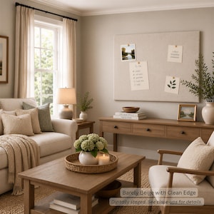 May include: A large rectangular beige fabric-covered bulletin board mounted on a wall, featuring four pinned papers including a to-do list, a landscape photograph, a botanical illustration, and a note with the text collect beautiful moments.