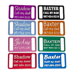 May include: Eight different colored metal dog tags with white text. The tags read "Shadow Call my dad! 987-654-3210" and "Baxter Call my dad! 987-654-3210".