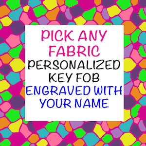 May include: A colorful mosaic background with a white square in the center. The text inside the square reads "PICK ANY FABRIC PERSONALIZED KEY FOB ENGRAVED WITH YOUR NAME".