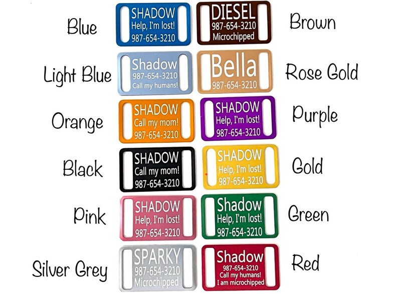 May include: A set of ten dog ID tags in various colors, including blue, light blue, orange, black, pink, silver grey, brown, rose gold, purple, and gold. Each tag features a different name and phone number, with some tags also including the text "Microchipped" or "Help, I'm lost!"