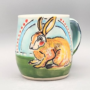 Fauve style rabbit fancifully handpainted on a handmade ceramic mug