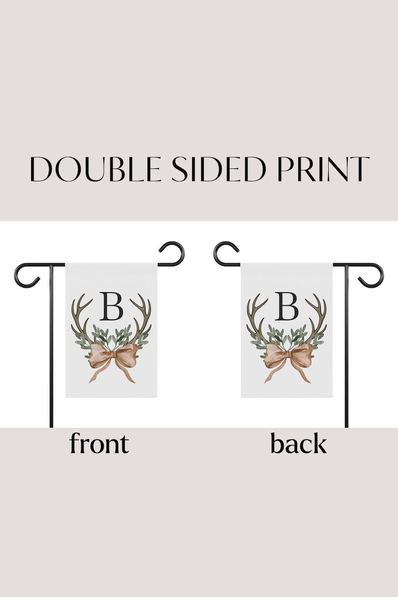 May include: Double-sided garden flag with a white background. The flag features a watercolor design of antlers, greenery, and a bow, with the letter "B" in the center. The text "DOUBLE SIDED PRINT" is at the top.