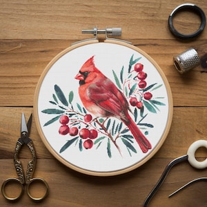 May include: A red cardinal bird perched on a branch with green leaves and red berries. The bird is depicted in a watercolor style and is surrounded by a white background.