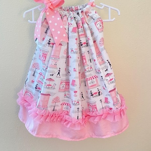 Paris Print Dress with lots of Pink colors. Ruffels and Bows