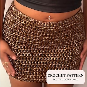 May include: A gold-colored crochet mini skirt. The skirt is made of a textured, open-weave material. The text "CROCHET PATTERN DIGITAL DOWNLOAD" is displayed in a white box at the bottom of the image.