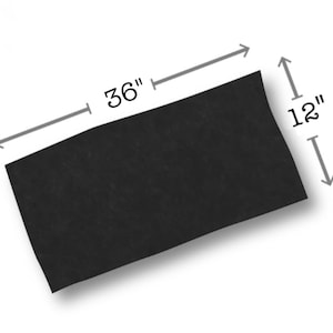 May include: A rectangular black sheet with a matte finish. Dimension arrows indicate a length of 36 inches and a width of 12 inches. The object is presented against a plain background, highlighting its flat, uniform surface and precise rectangular shape.