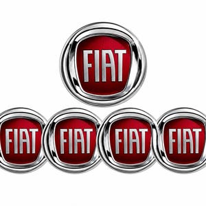 May include: Five circular Fiat emblems arranged in a pyramid formation. Each emblem features a deep red background with a subtle vertical texture, the word FIAT in bold silver lettering, and a thick, polished silver metallic border surrounding it.