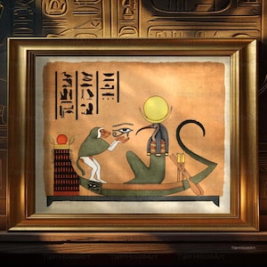 May include: A framed wall art print featuring an ancient Egyptian scene on a tan papyrus-style background. A baboon and a bird-headed deity sit in a boat, with the baboon holding the Eye of Horus. Hieroglyphs are visible in the upper left corner.