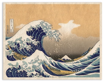 May include: A print of the Great Wave off Kanagawa featuring a large, dark blue cresting wave with white foam, three wooden boats navigating the turbulent water, and a distant Mount Fuji against a tan background with Japanese text.