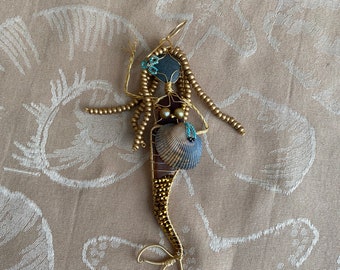 Sea Glass Mermaid with beads and gold wire.