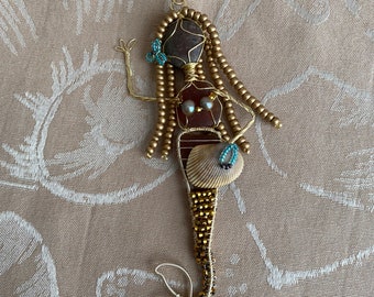 Sea Glass Mermaid with beads and gold wire.