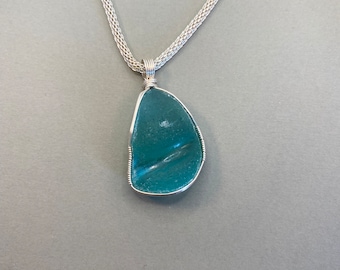 Sea glass necklace - aqua wrapped in sterling silver wire on a silver color 18 inch mesh chain.