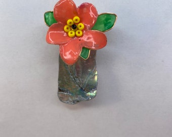 Refrigerator magnet with abolone shell and hand made flowers.