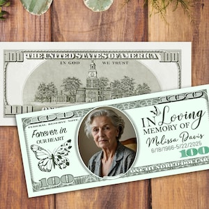 May include: A custom memorial bill featuring a portrait of a woman, a butterfly graphic, and the text "Forever in Our Heart." The bill also includes the text "In Loving Memory of Melissa Davis 6/18/1966-5/22/2025" and the denomination "100".