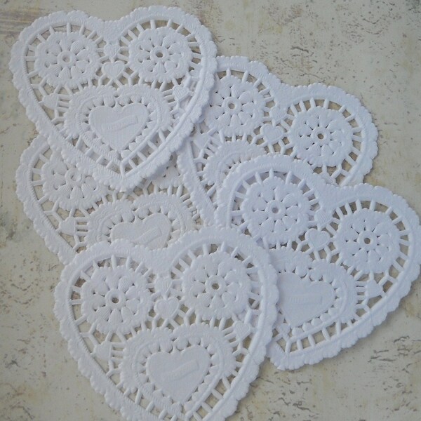 One dozen white petite heart shape paper doilies