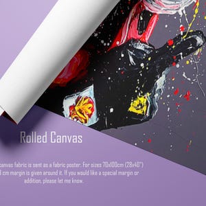 May include: Rolled canvas art print featuring a close-up of a hand with red, black, and yellow paint splatters. The canvas is rolled up, revealing a white edge. The text "Rolled Canvas" is visible.