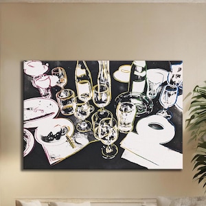 May include: A pop art style canvas print featuring a table setting with wine glasses, plates, bottles, and a napkin. The artwork uses bold outlines and contrasting colors, creating a striking visual effect. The overall theme is a dining or party setting.