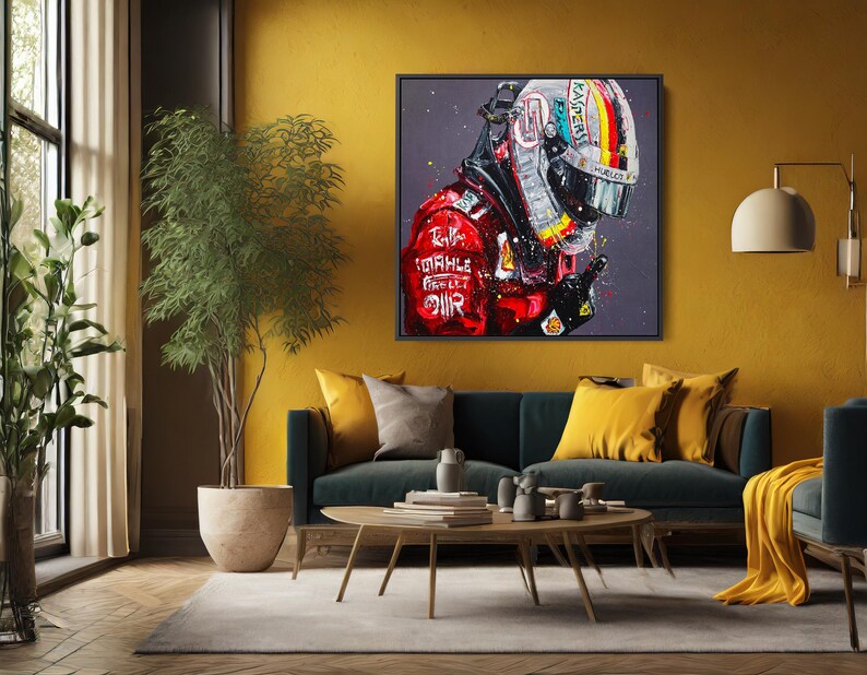May include: A framed artwork depicts a Formula 1 driver in a helmet and racing suit. The helmet features a colorful design, and the suit is red with sponsor logos. The artwork is displayed in a living room setting.