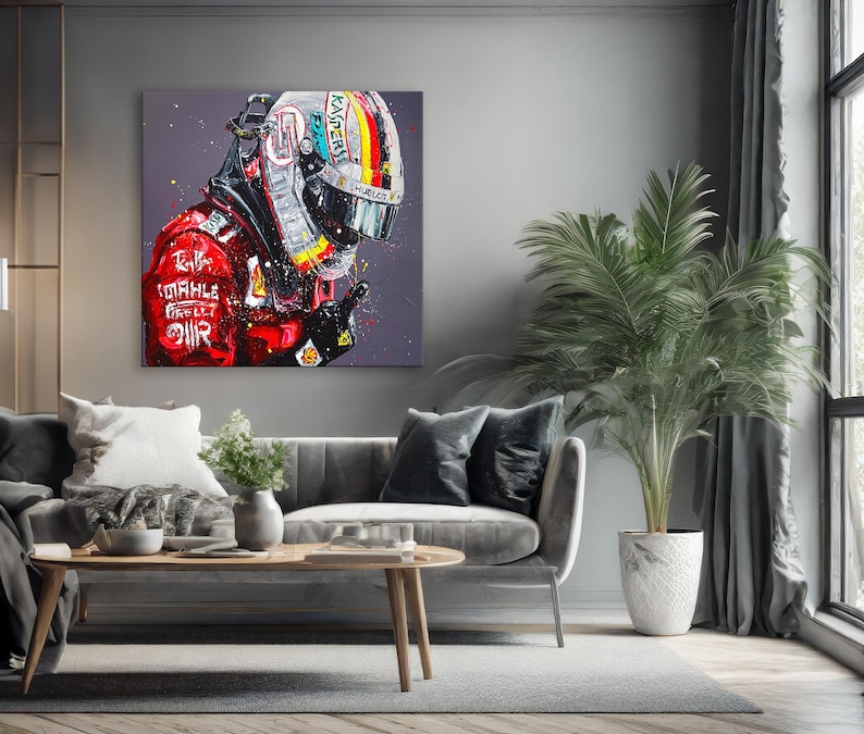 May include: A square canvas art print featuring a portrait of a racing driver in a helmet and red racing suit. The helmet is silver with a rainbow stripe and the suit has sponsor logos. The artwork is set against a gray background.