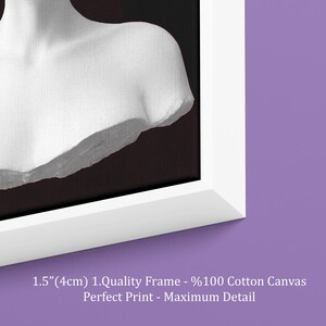 May include: A framed canvas print showing a grayscale bust sculpture against a dark backdrop. The white frame is 4cm thick. The text on the print reads: 1.Quality Frame - %100 Cotton Canvas, Perfect Print - Maximum Detail.