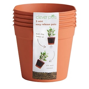 May include: A set of five terracotta coloured mini easy release pots. The pots are stacked on top of each other. The label on the front of the pots reads "Clever Pots 5 mini easy release pots" and shows a diagram of how to remove a plant from the pot.