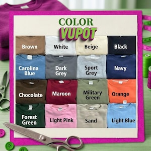 May include: A color chart featuring fifteen folded sweatshirts in various shades including brown, white, beige, black, carolina blue, dark grey, sport grey, navy, chocolate, maroon, military green, orange, forest green, light pink, sand, and light blue.