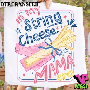May include: White graphic featuring the text "In my String Cheese Mama Era" with a cartoon illustration of string cheese tied with a blue ribbon. The design includes pink, blue, yellow, and white elements.