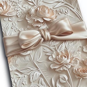 May include: A white box with a floral design and a large satin bow. The box is decorated with raised flowers and leaves.