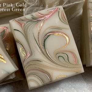 Soap favors handmade with a pink green and gold mica to swirl. Colors are custom to your shower theme.