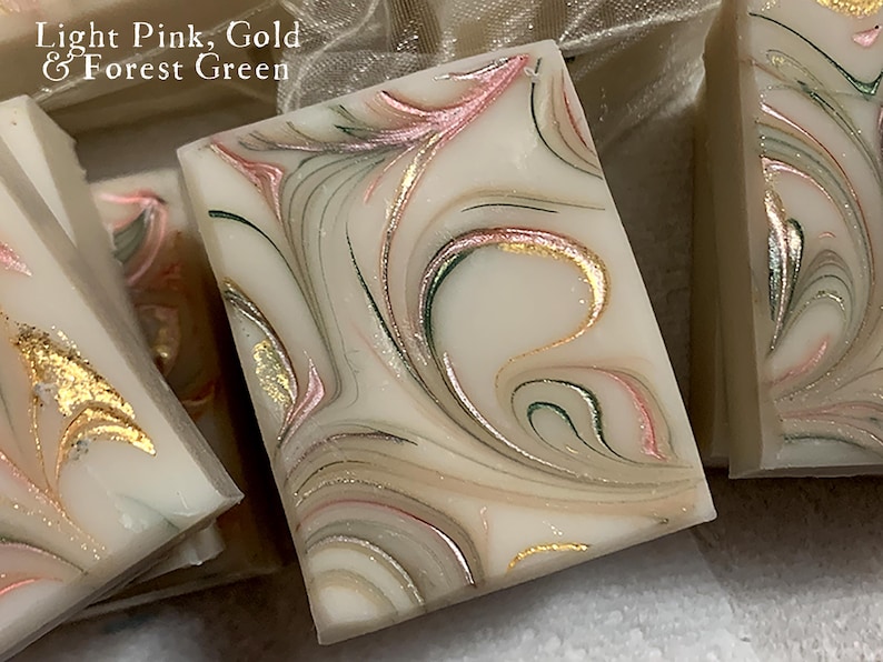Soap favors handmade with a pink green and gold mica to swirl. Colors are custom to your shower theme.