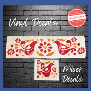 May include: Two vinyl decals featuring a stylized bird design with orange and red accents. The decals are on a white background. The text "Vinyl Decals" and "Mixer Decals" is visible in the image.