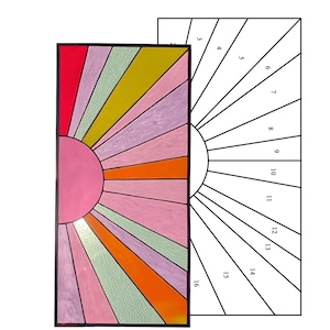 May include: A stained glass panel featuring a sunburst design. The sun is a pink circle, with rays in shades of red, yellow, orange, pink, and green. A separate pattern sheet shows the numbered sections for the design.