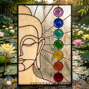 May include: A rectangular stained glass panel featuring a cream-colored profile of a Buddha face on the left side. The right side displays seven circular glass accents in purple, blue, teal, green, yellow, orange, and red, arranged vertically.