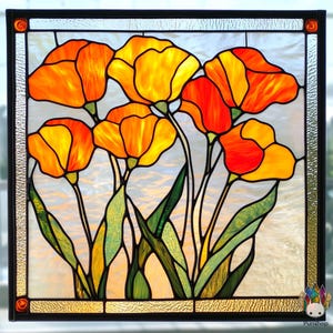 May include: A stained glass window depicting a bouquet of orange and yellow poppies with green stems and leaves.