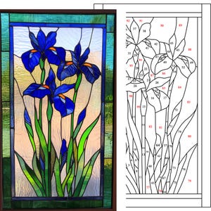 May include: A stained glass window depicting three blue irises with green leaves and stems. The window is divided into 99 individual pieces of glass, each with a unique shape and color.