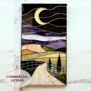 May include: Stained glass panel depicting a night landscape with a crescent moon, stars, and rolling hills in shades of purple, yellow, and green. The artwork includes a road and trees, framed with a metal border. The text "COMMERCIAL LICENSE" is visible.